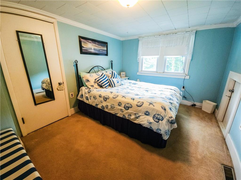 496 Great Belt Road Butler, PA 16002 - Photo 11 of 33 a bedroom with a bed and a window