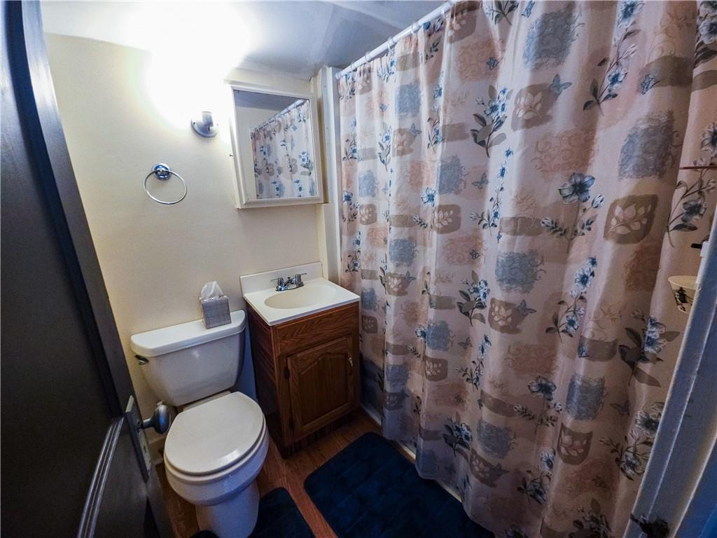 496 Great Belt Road Butler, PA 16002 - Photo 29 of 33 a white toilet sitting next to a small sink