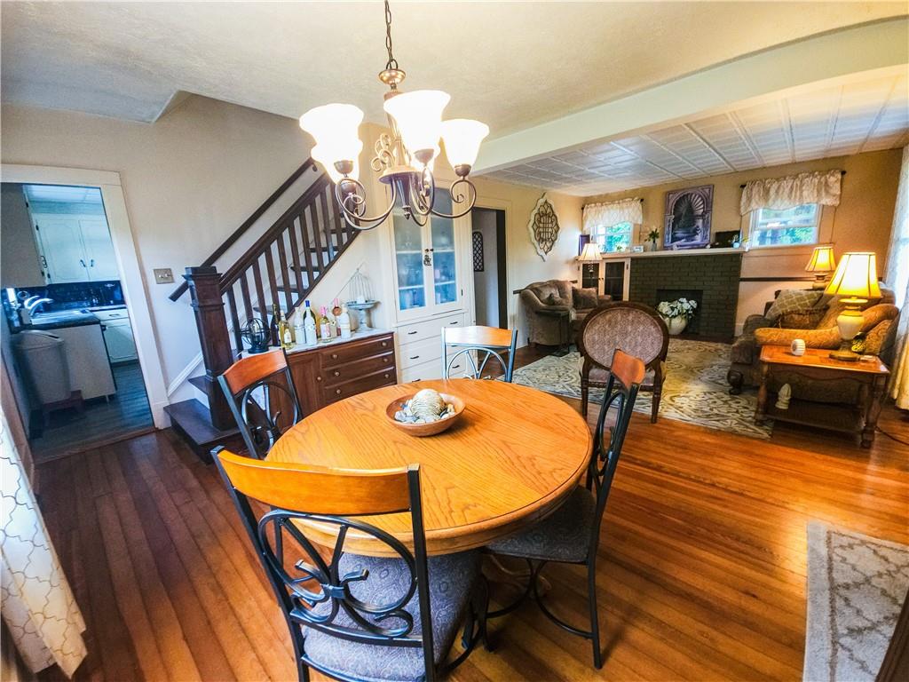 496 Great Belt Road Butler, PA 16002 - Photo 6 of 33 a view of a dining room with furniture wooden floor and chandelier