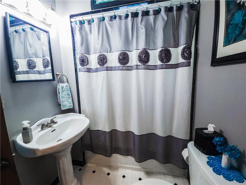 496 Great Belt Road Butler, PA 16002 - Photo 10 of 33 a bathroom with a sink and a mirror