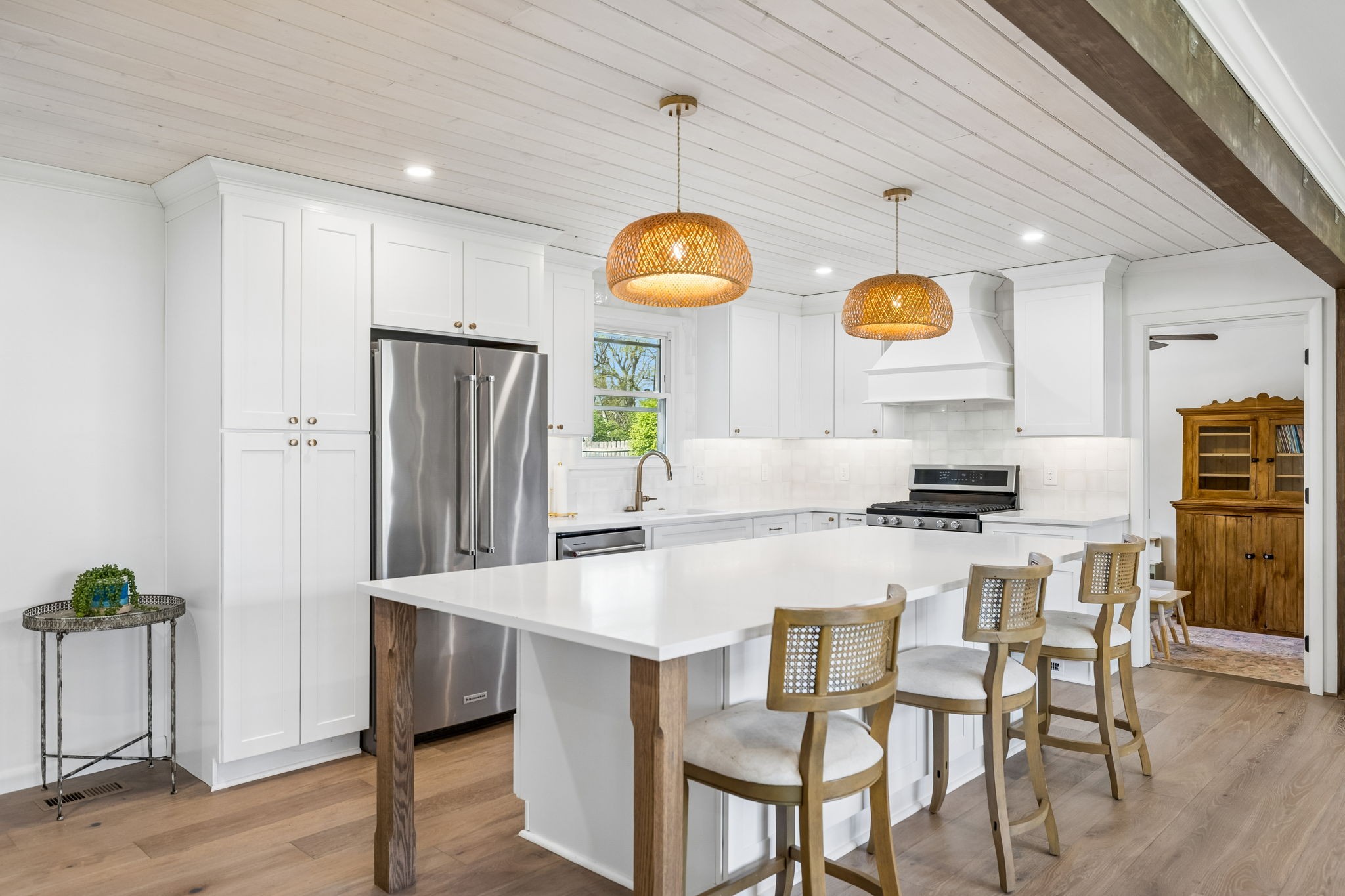 383 Blackman Road Nashville, TN 37211 - Photo 16 of 71 a kitchen with stainless steel appliances a dining table chairs and wooden floor