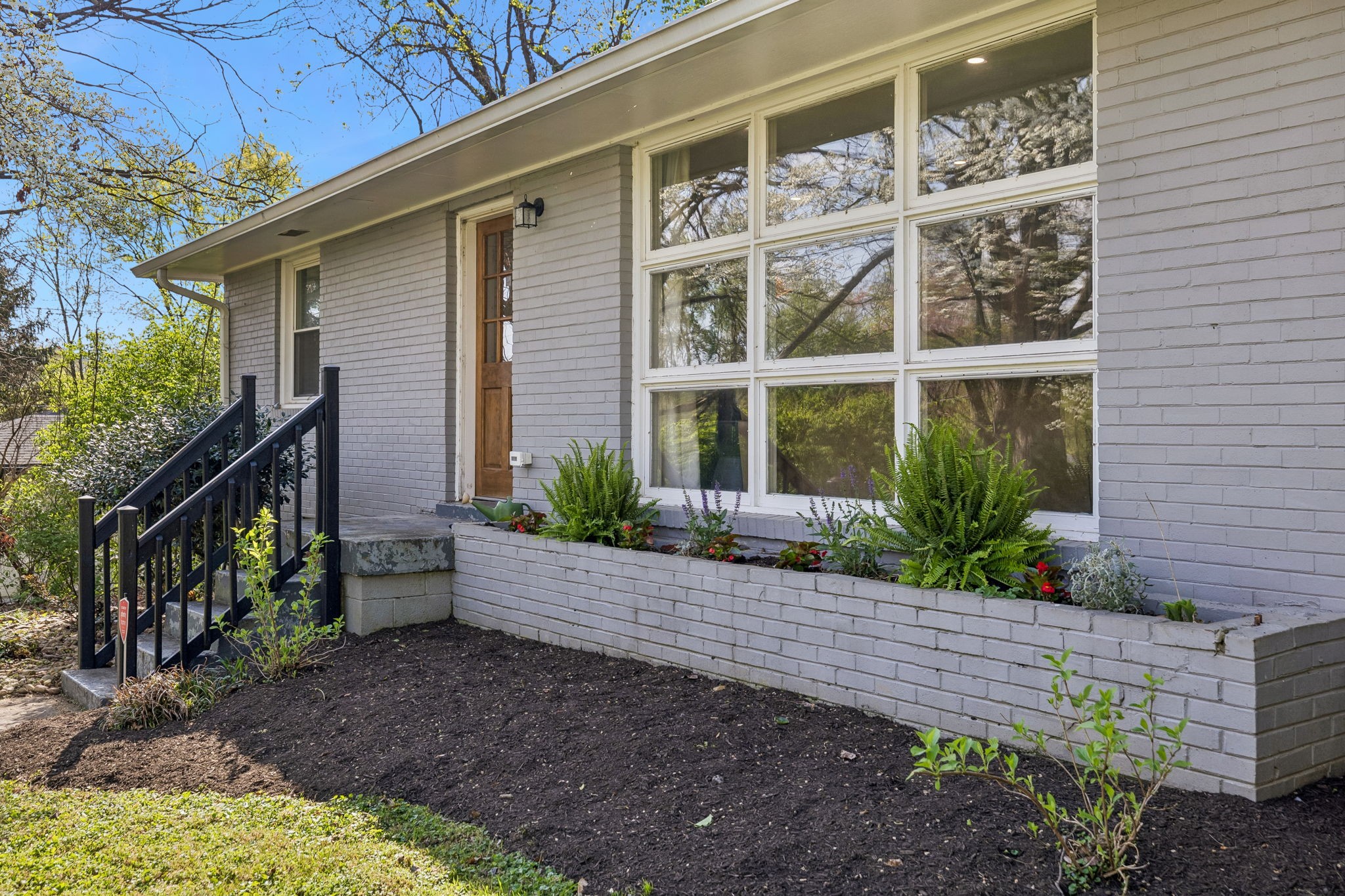 383 Blackman Road Nashville, TN 37211 - Photo 2 of 71 a front view of a house with a yard