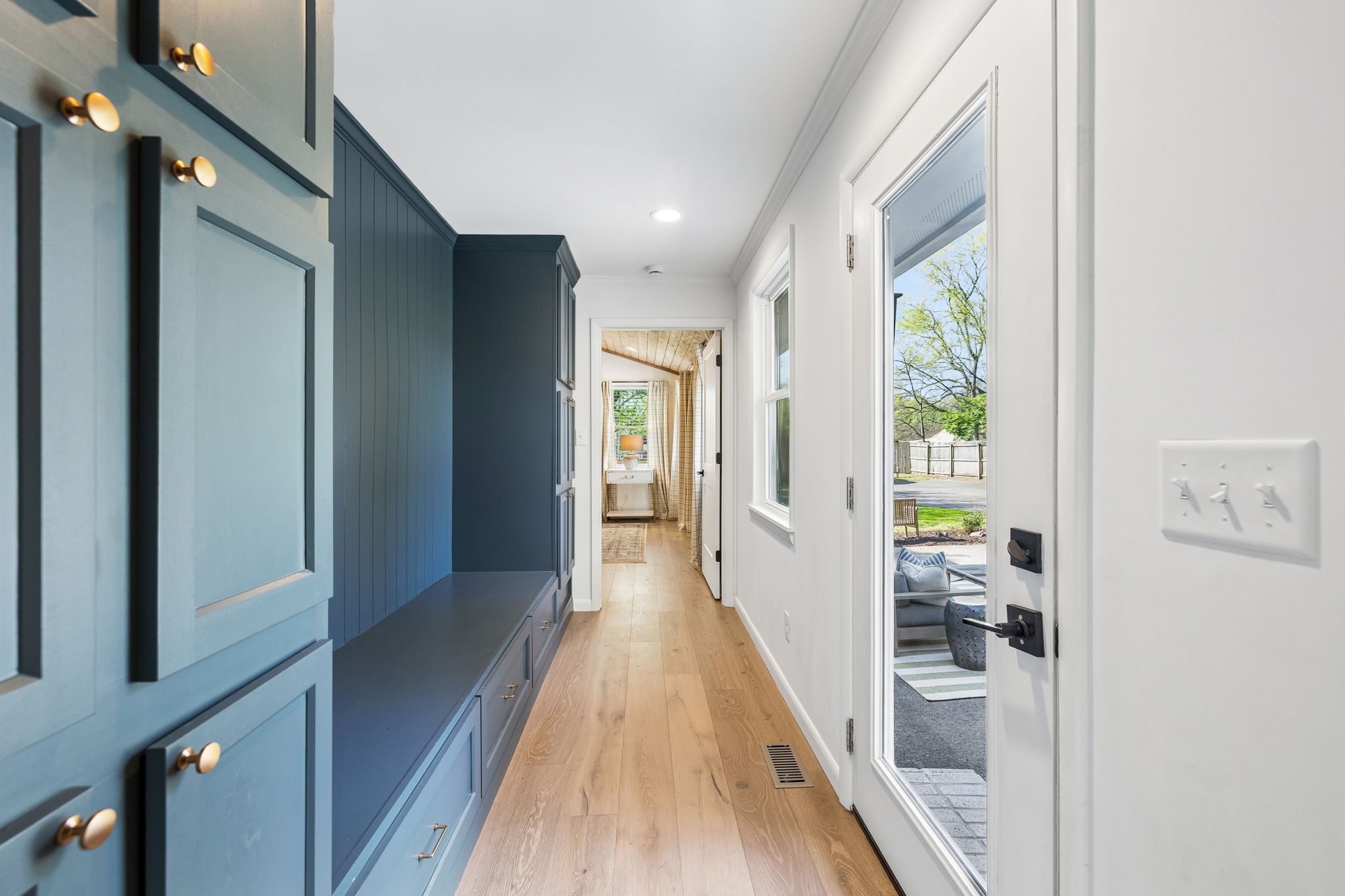 383 Blackman Road Nashville, TN 37211 - Photo 22 of 71 a view of a hallway with wooden floor and a living room