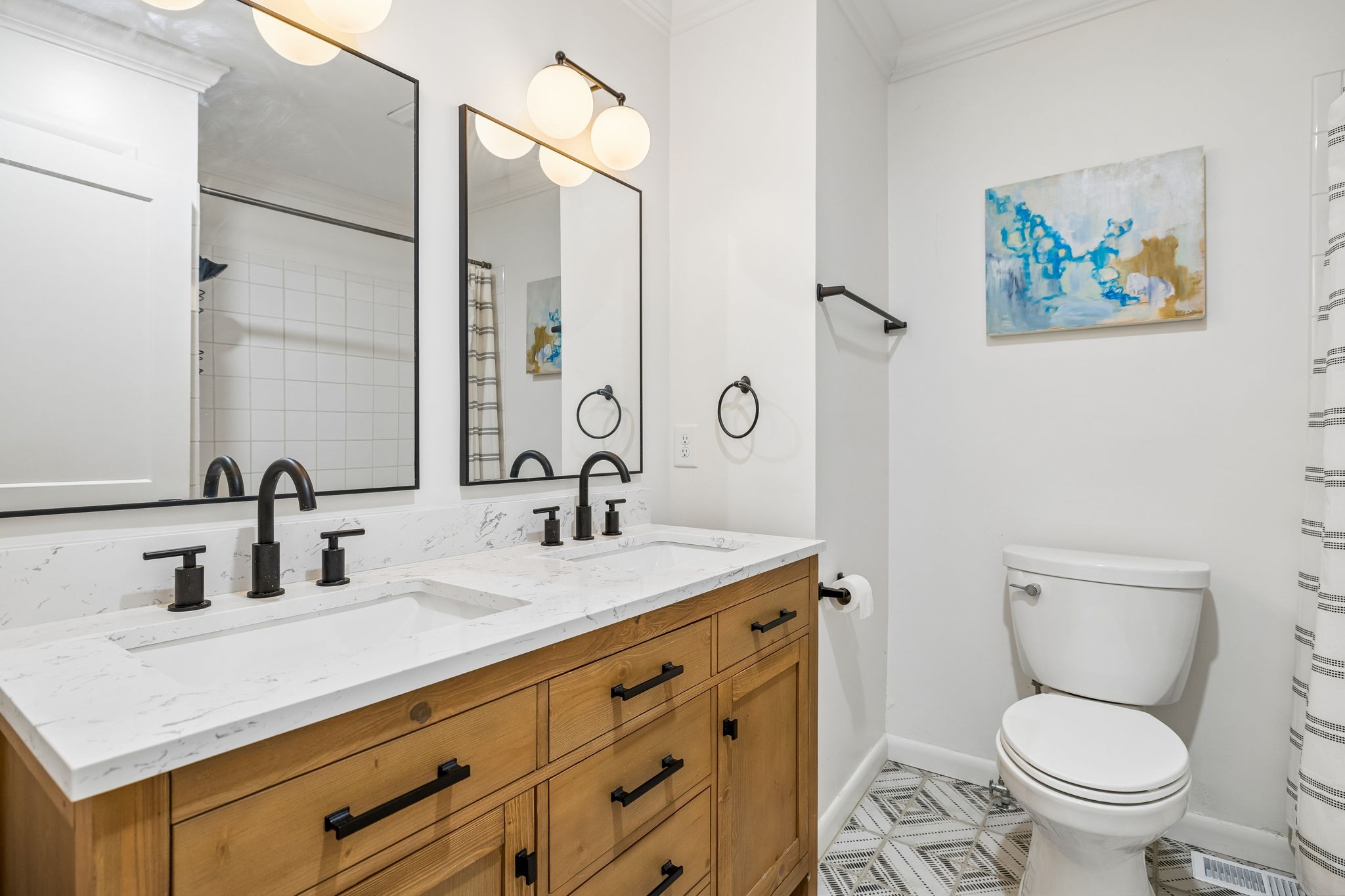 383 Blackman Road Nashville, TN 37211 - Photo 38 of 71 a bathroom with a toilet sink and mirror
