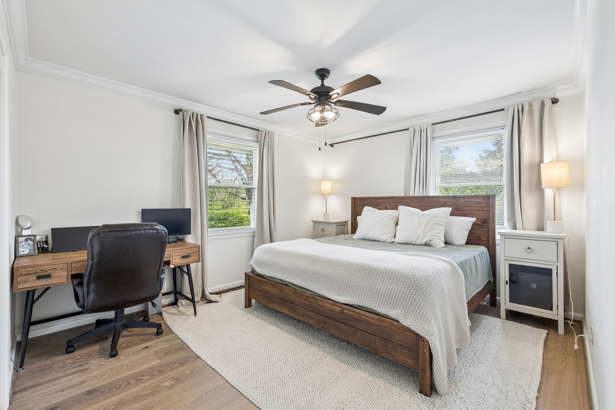 383 Blackman Road Nashville, TN 37211 - Photo 40 of 71 a bedroom with a bed a desk and chair with wooden floor