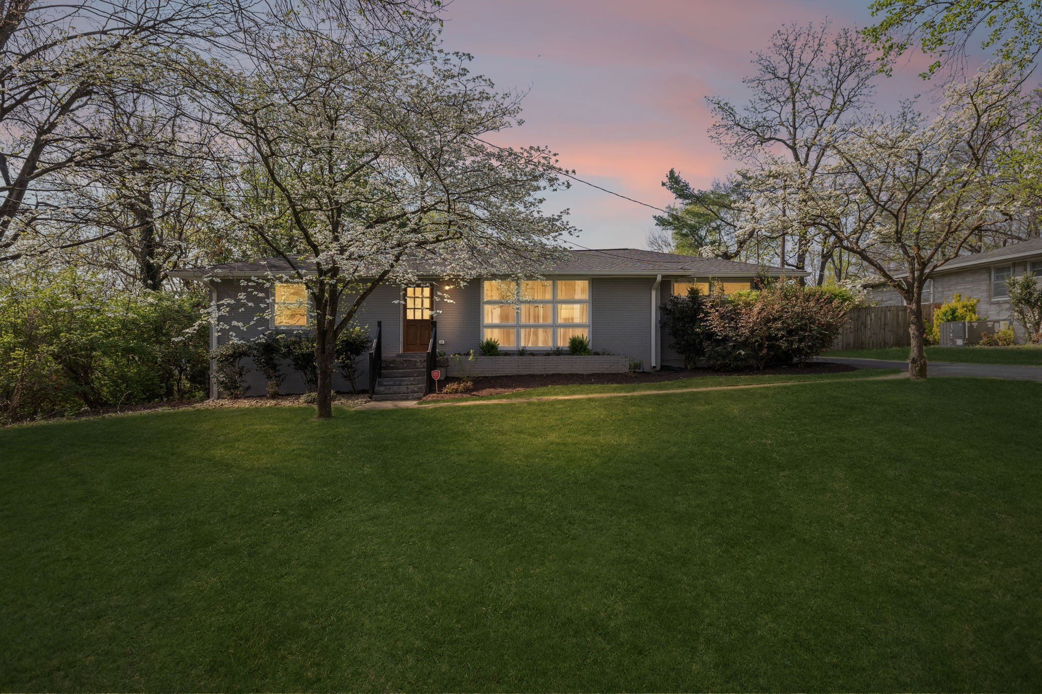 383 Blackman Road Nashville, TN 37211 - Photo 4 of 71 a front view of a house with a garden