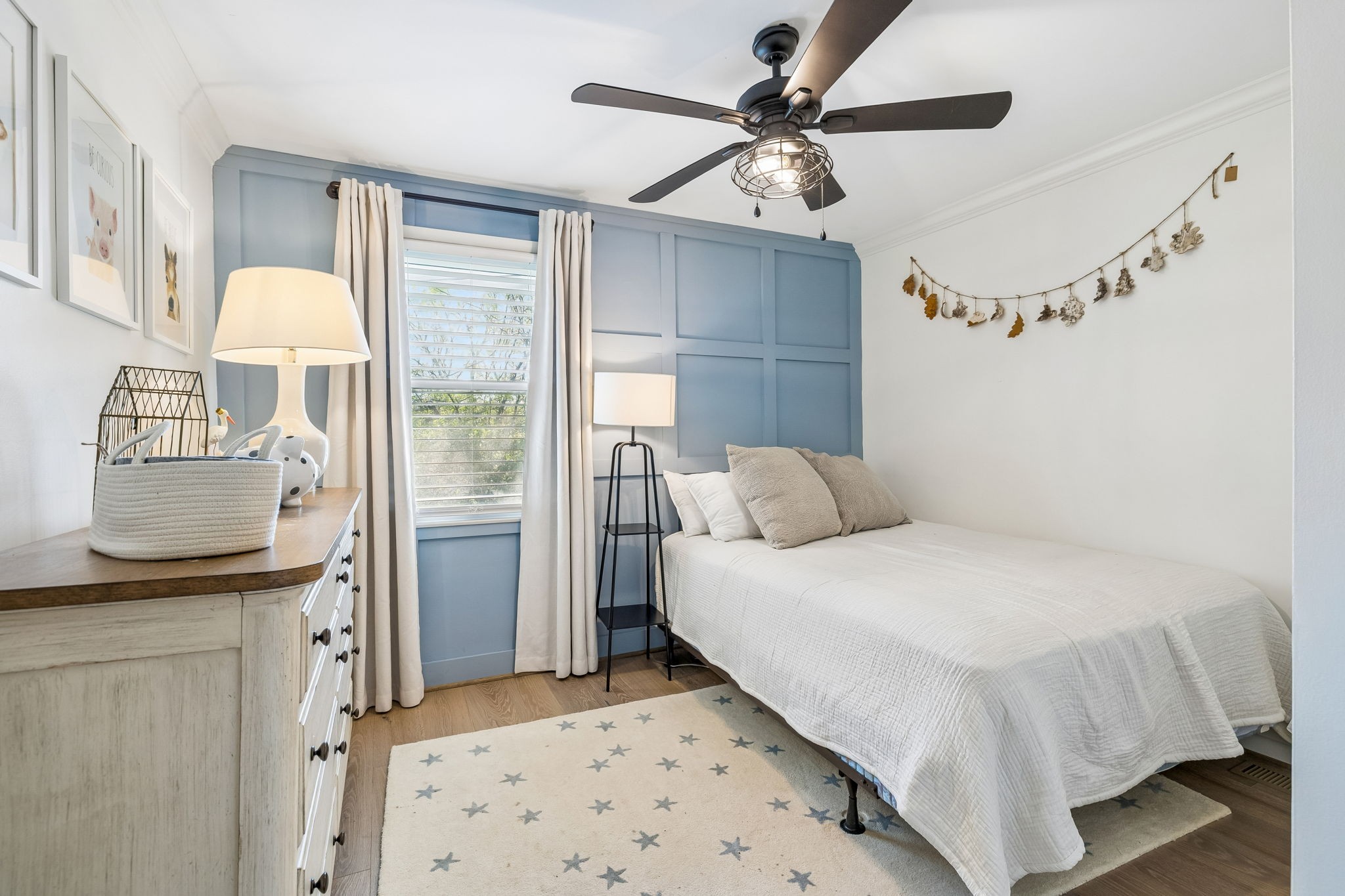 383 Blackman Road Nashville, TN 37211 - Photo 43 of 71 a bedroom with a bed and a chandelier