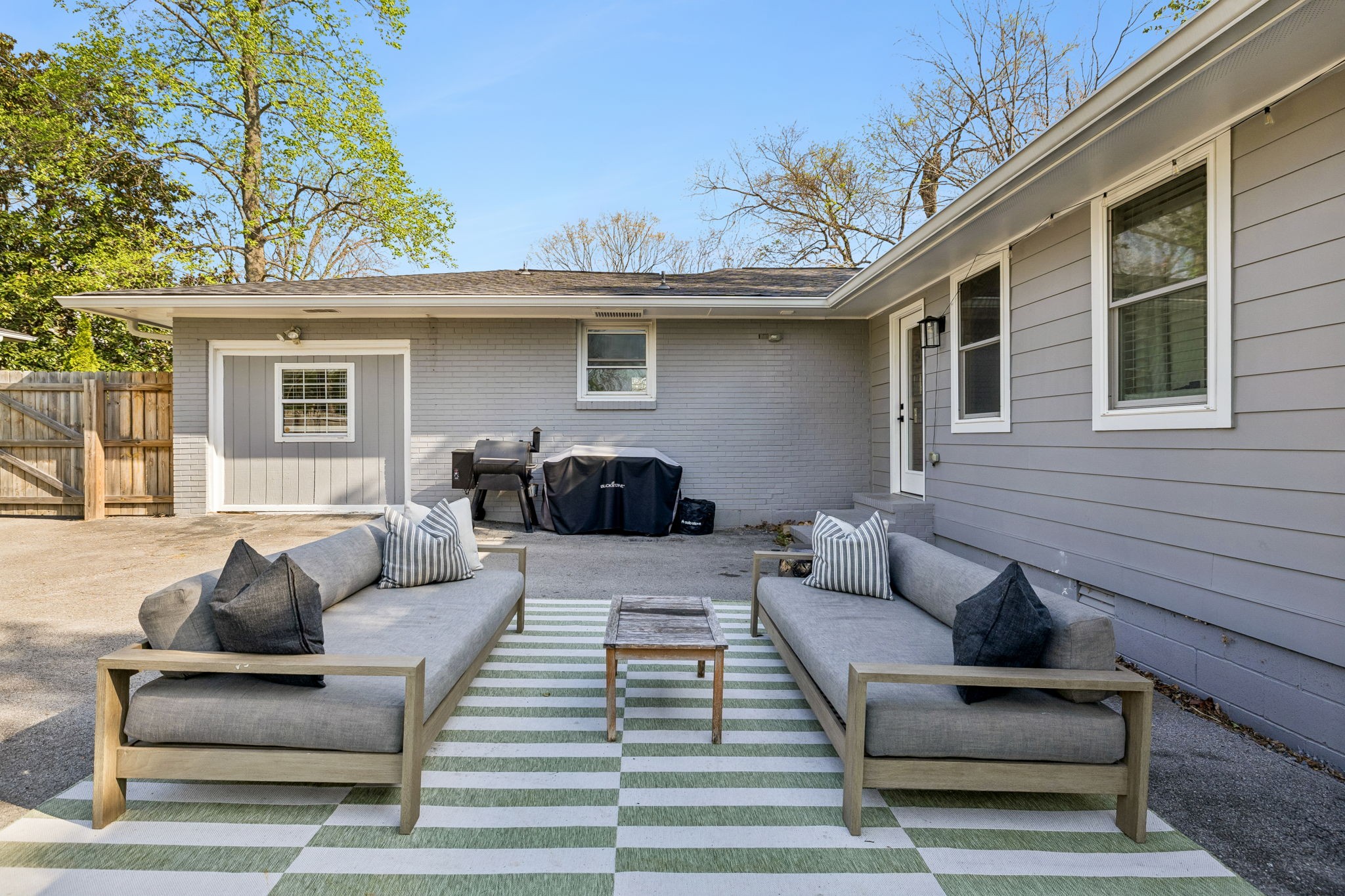 383 Blackman Road Nashville, TN 37211 - Photo 47 of 71 a view of a patio with couches and a potted plant on a table