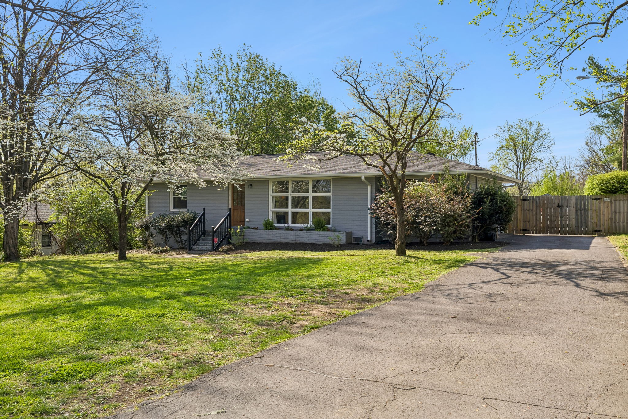 383 Blackman Road Nashville, TN 37211 - Photo 5 of 71 a front view of a house with a yard and garage