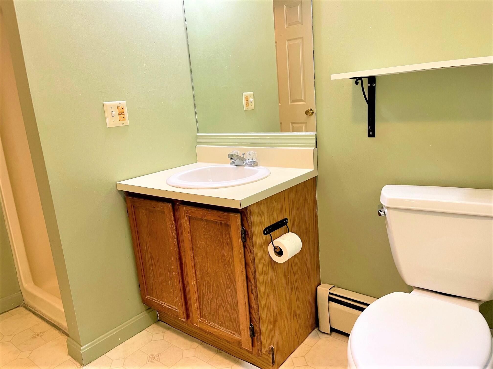 8 Boylston Drive Edgartown, MA 02539 - Photo 10 of 17 a bathroom with a sink a toilet and a mirror