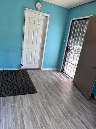 a view of a room with wooden staircase