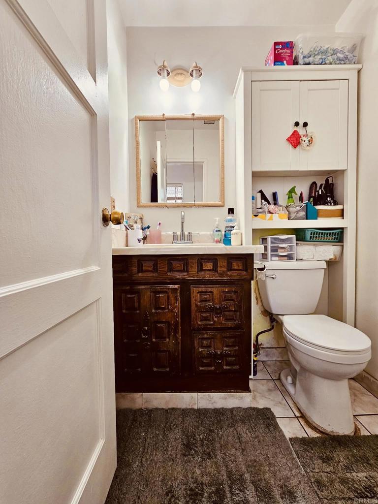 3333 Delta Avenue Long Beach, CA 90810 - Photo 21 of 31 a bathroom with a sink and a mirror