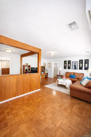 a living room with furniture and a table