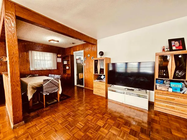 a lobby with furniture and a rug