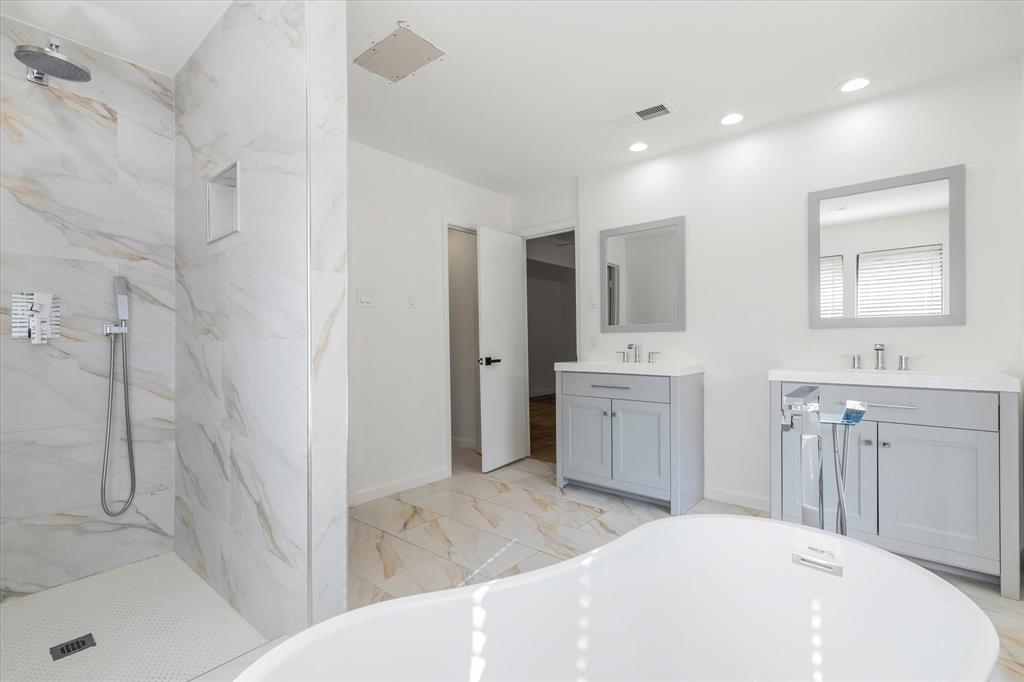 17003 Davenport Road Dallas, TX 75248 - Photo 27 of 40 a bathroom with a sink a toilet and shower