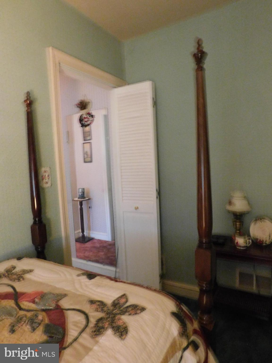 8504 Oakleigh Road Baltimore, MD 21234 - Photo 15 of 35 a bedroom with a bed and a dresser in it