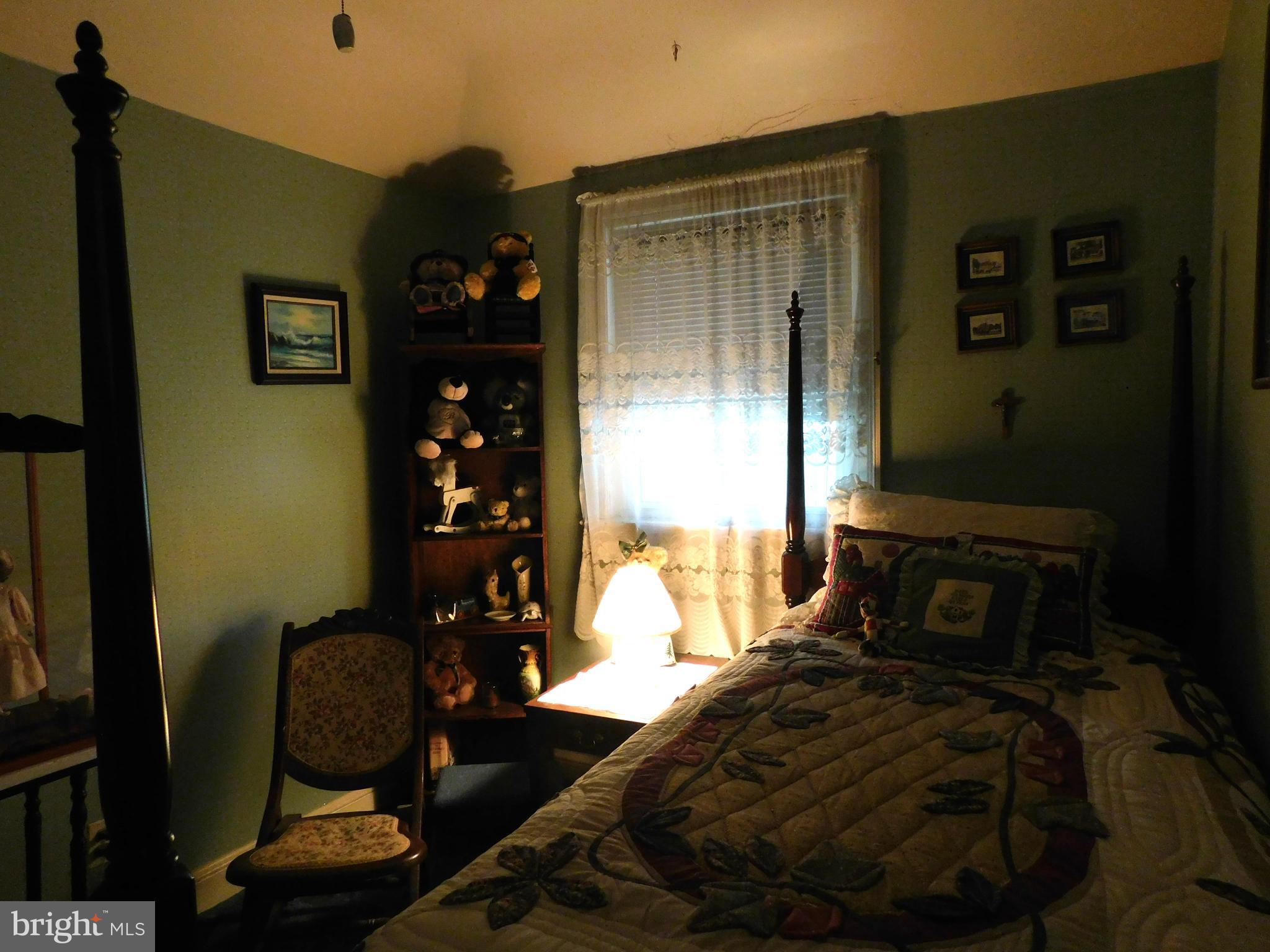 8504 Oakleigh Road Baltimore, MD 21234 - Photo 17 of 35 a bedroom with a bed and a window
