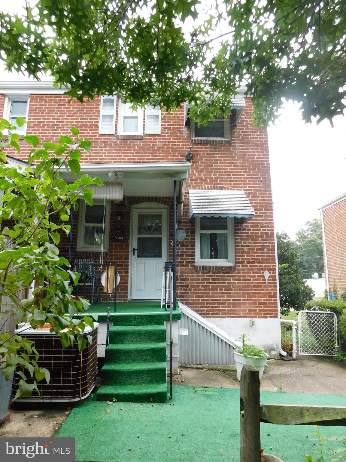 8504 Oakleigh Road Baltimore, MD 21234 - Photo 29 of 35 a front view of a house with garden