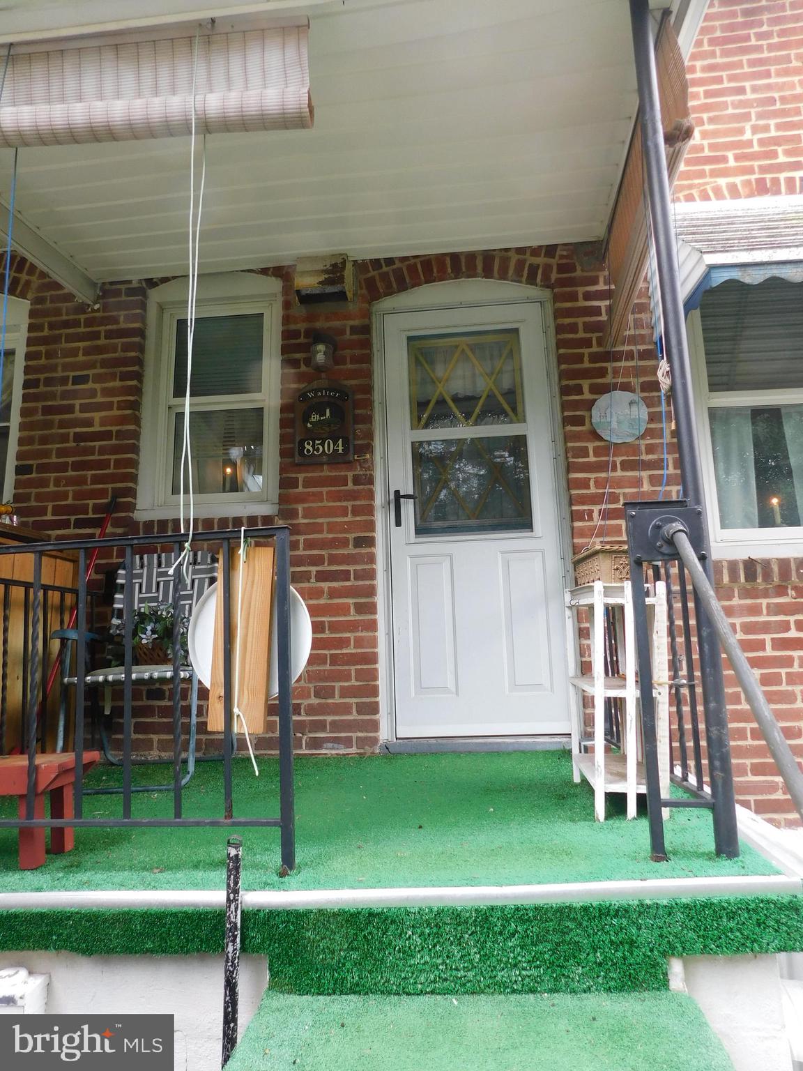 8504 Oakleigh Road Baltimore, MD 21234 - Photo 30 of 35 a front view of a house with a garden