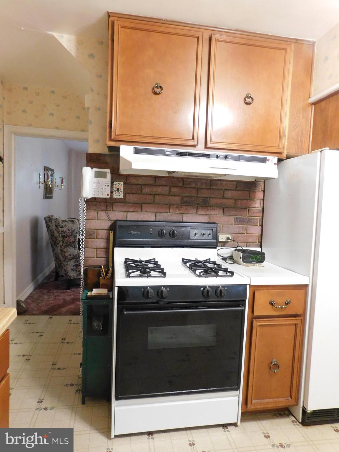 8504 Oakleigh Road Baltimore, MD 21234 - Photo 6 of 35 a stove top oven sitting inside of a kitchen