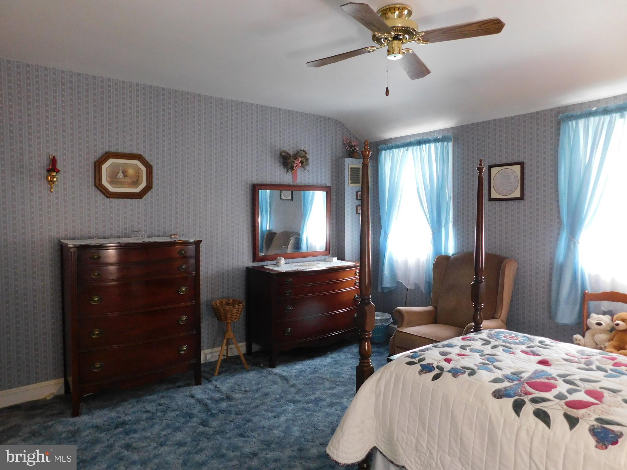8504 Oakleigh Road Baltimore, MD 21234 - Photo 10 of 35 a bedroom with a bed and a dresser