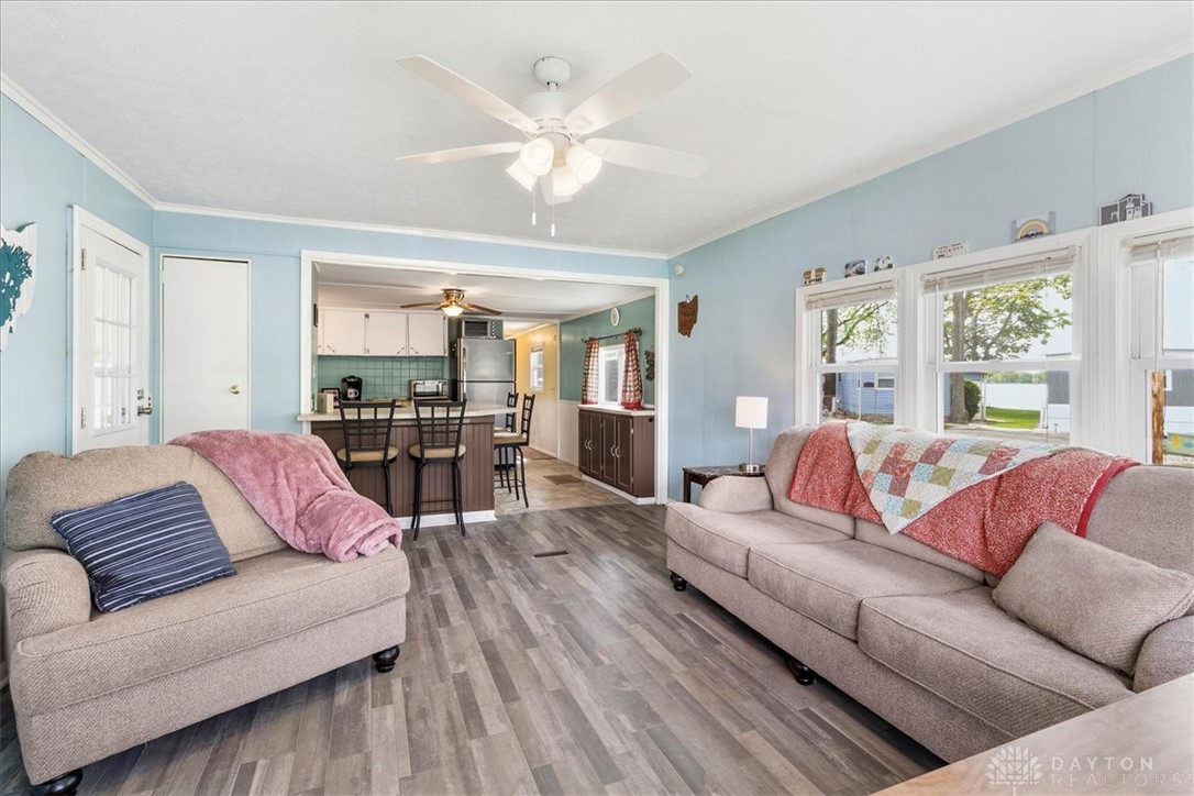 246 North Orchard Island Road Russells Point, OH 43348 - Photo 12 of 43 This living room flows into the kitchen creating a harmonious, inviting atmosphere.