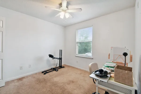 a room with gym equipment and a window