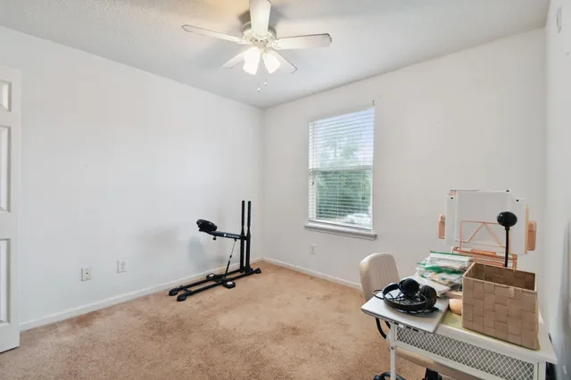 a room with gym equipment and a window