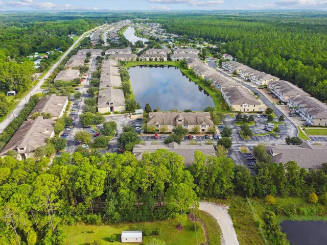 a view of pool with a yard