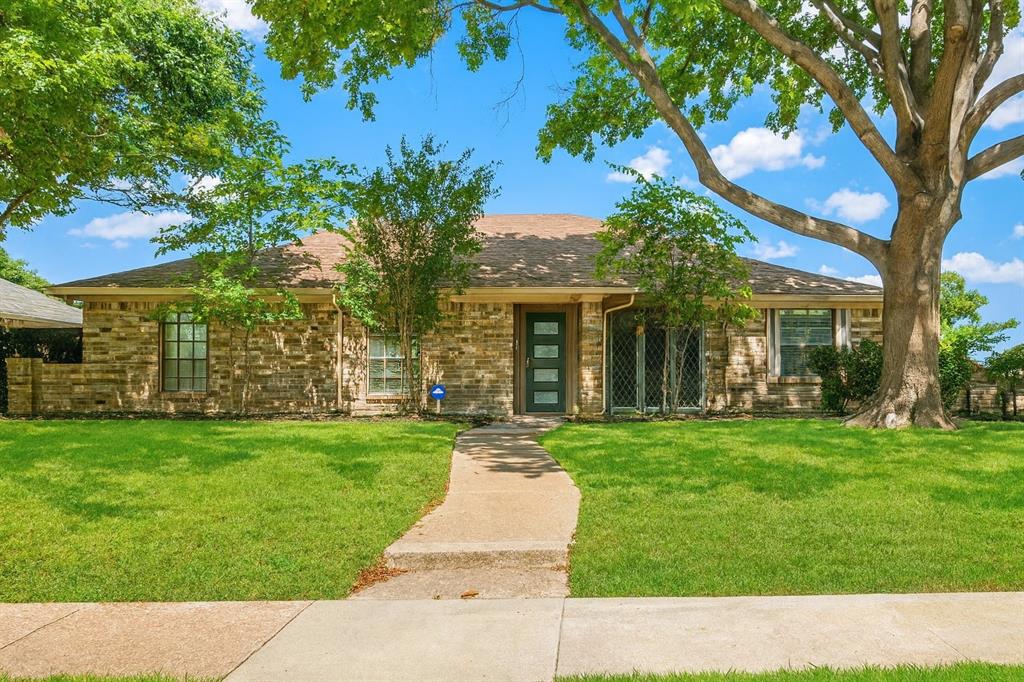 front view of a house with a garden