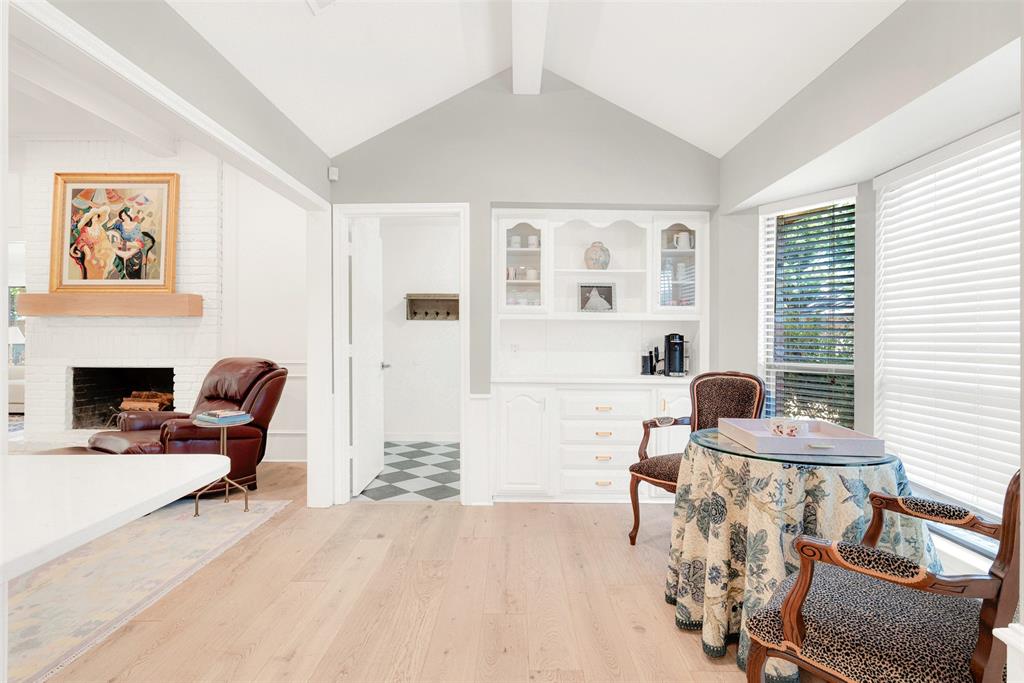 1601 Geneva Lane Plano, TX 75075 - Photo 13 of 38 a living room with furniture a fireplace and next to a window