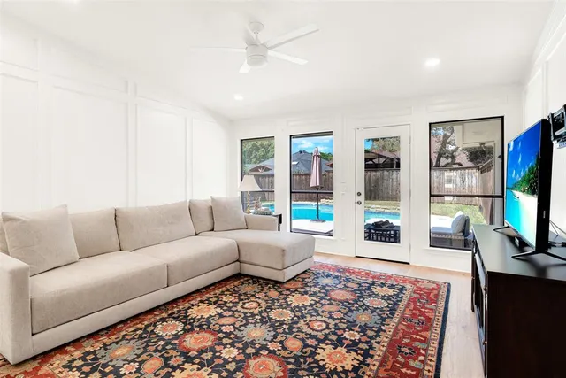 a living room with furniture and a rug