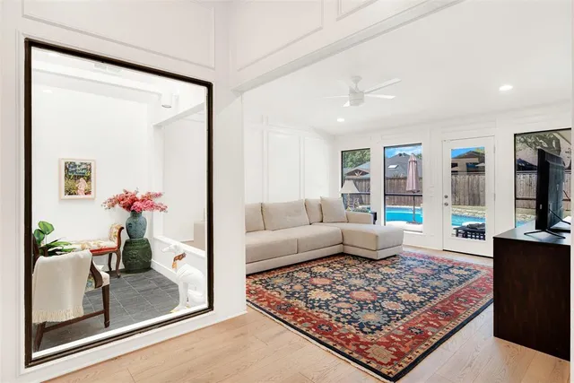 a living room with furniture and a rug