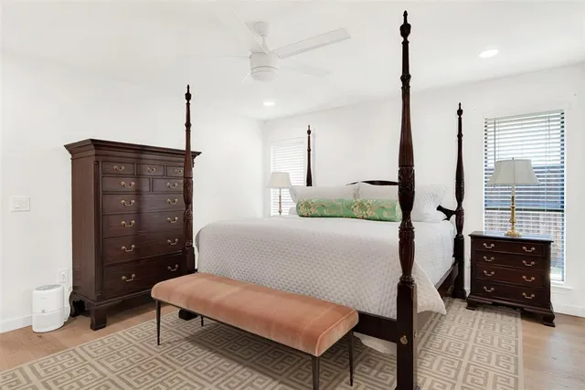 a bedroom with a bed window and walk in closet