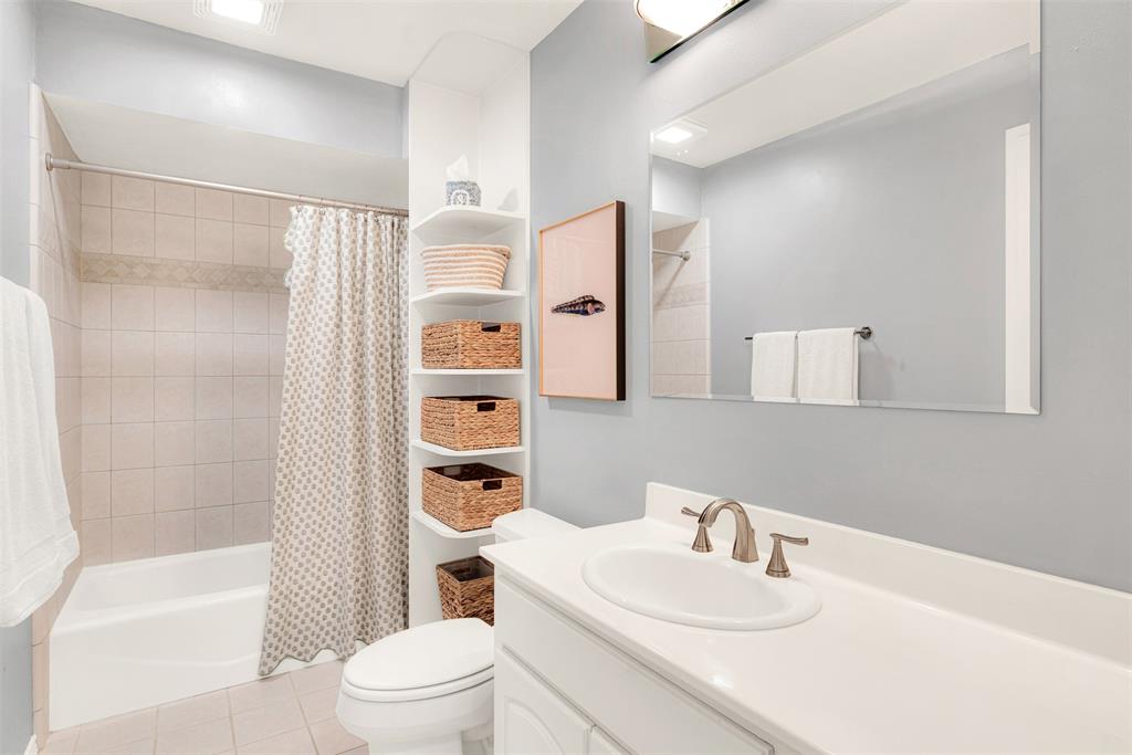1601 Geneva Lane Plano, TX 75075 - Photo 29 of 38 a bathroom with a sink a toilet and shower