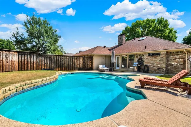 a view of a house with swimming pool