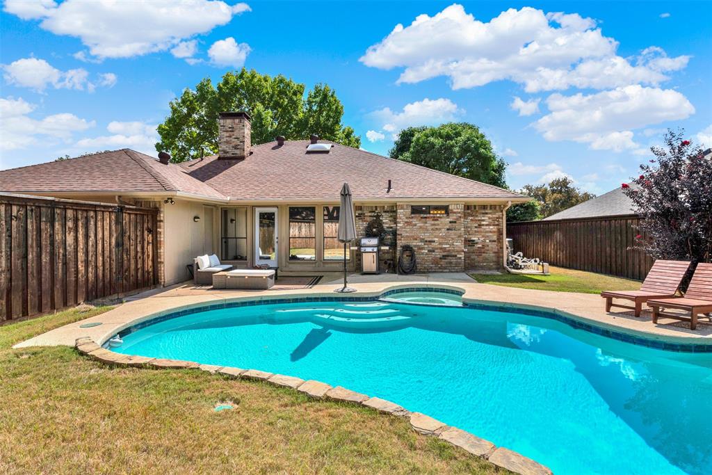 1601 Geneva Lane Plano, TX 75075 - Photo 34 of 38 a view of a swimming pool with lounge chair