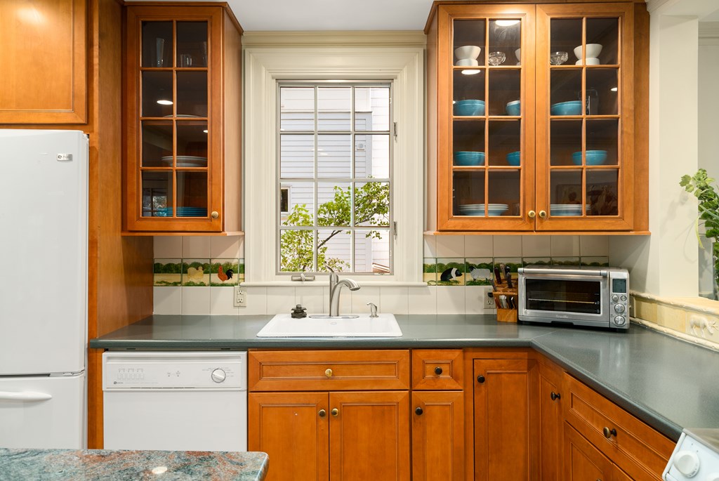 34 Upland Road Newton, MA 02468 - Photo 16 of 33 a kitchen with a sink and cabinets