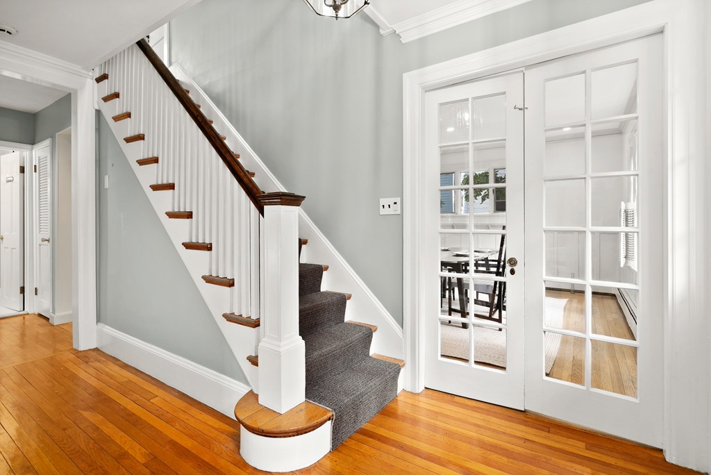 34 Upland Road Newton, MA 02468 - Photo 3 of 33 a view of entryway with wooden floor and front door