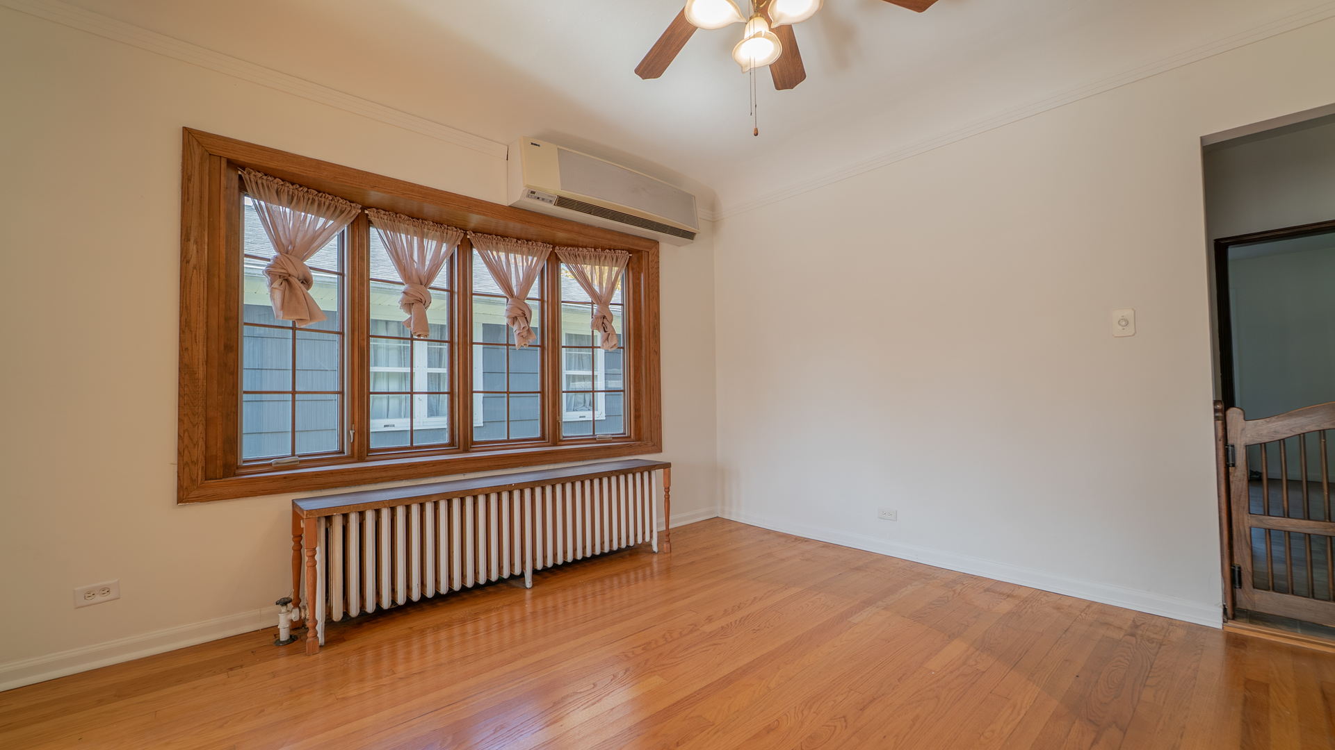 122 Elizabeth Street Calumet City, IL 60409 - Photo 11 of 31 an empty room with a window and a ceiling fan