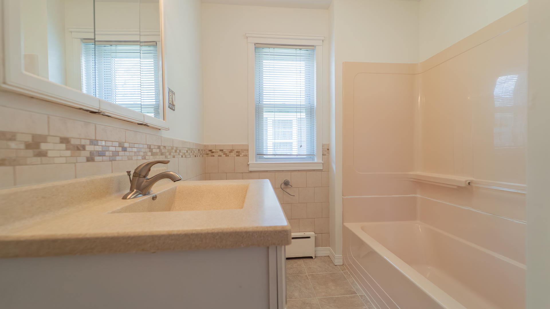 122 Elizabeth Street Calumet City, IL 60409 - Photo 14 of 31 a bathroom with a sink and a bathtub