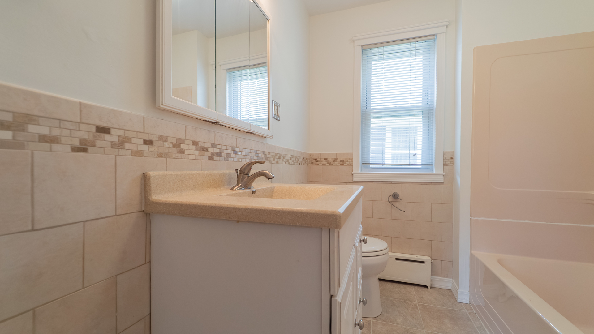 122 Elizabeth Street Calumet City, IL 60409 - Photo 15 of 31 a bathroom with a sink toilet and shower