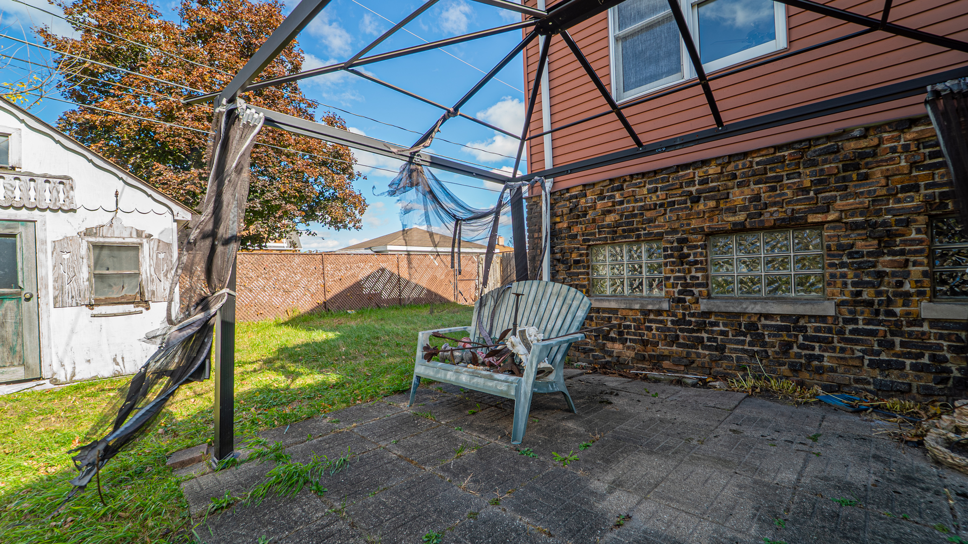 122 Elizabeth Street Calumet City, IL 60409 - Photo 27 of 31 a chair and table in the backyard of the house