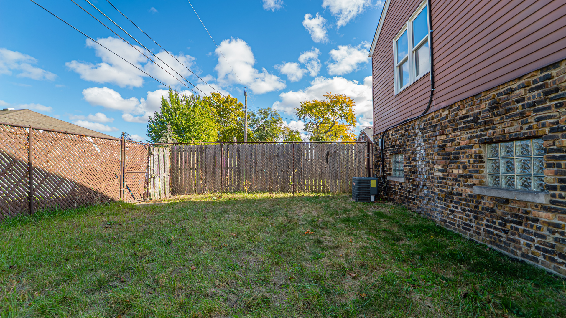 122 Elizabeth Street Calumet City, IL 60409 - Photo 29 of 31 a view of a backyard with brick wall