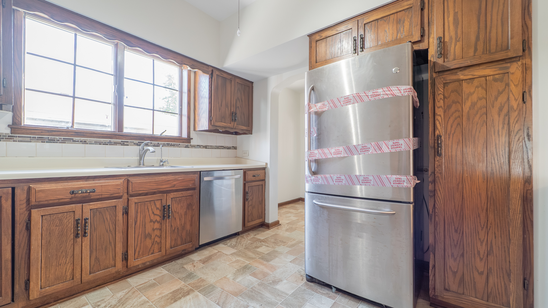 122 Elizabeth Street Calumet City, IL 60409 - Photo 8 of 31 a kitchen with stainless steel appliances granite countertop a refrigerator and a sink