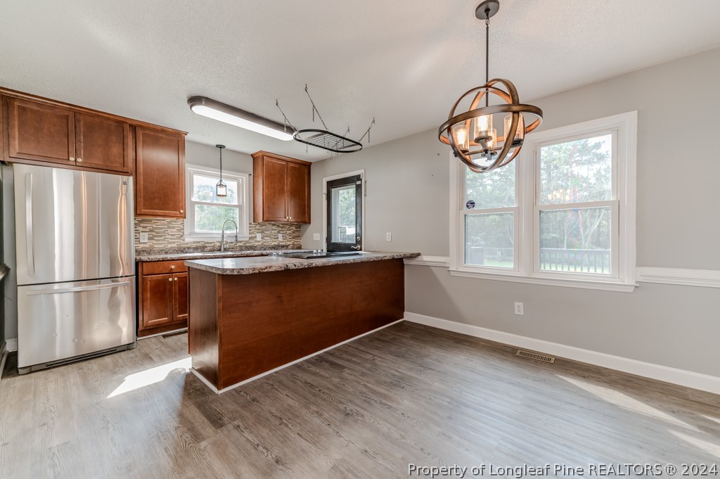 925 Line Road Cameron, NC 28326 - Photo 12 of 42 a view of kitchen with refrigerator and microwave