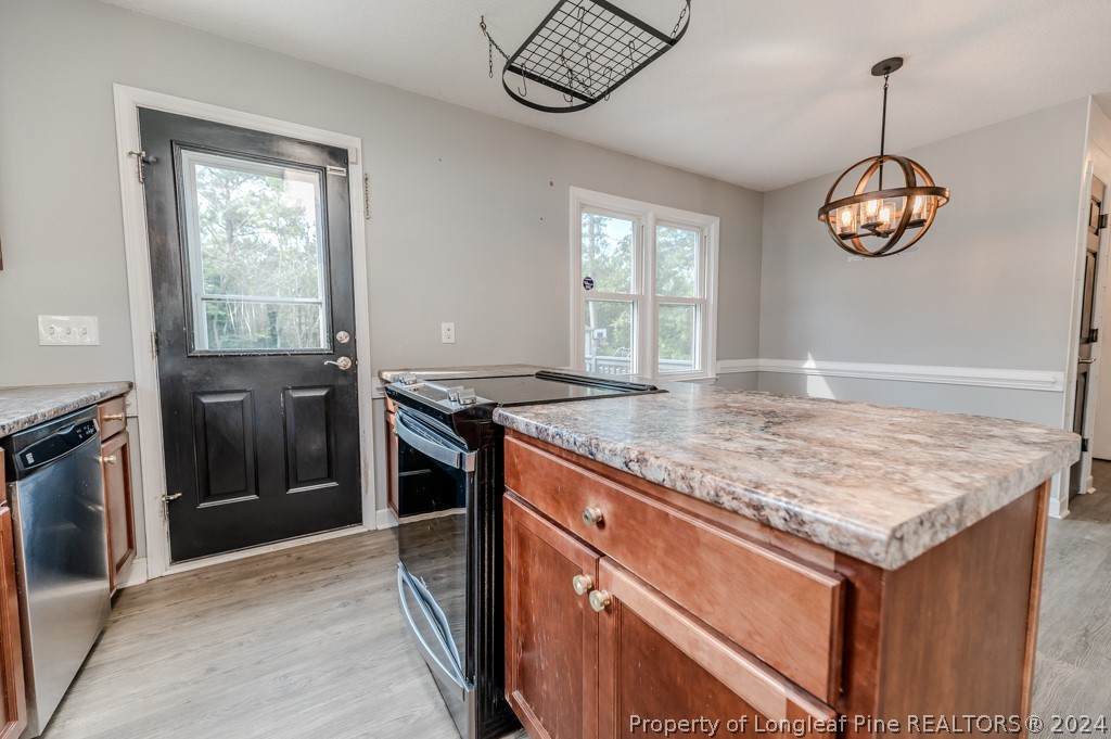 925 Line Road Cameron, NC 28326 - Photo 16 of 42 a kitchen with stainless steel appliances granite countertop a stove and a sink