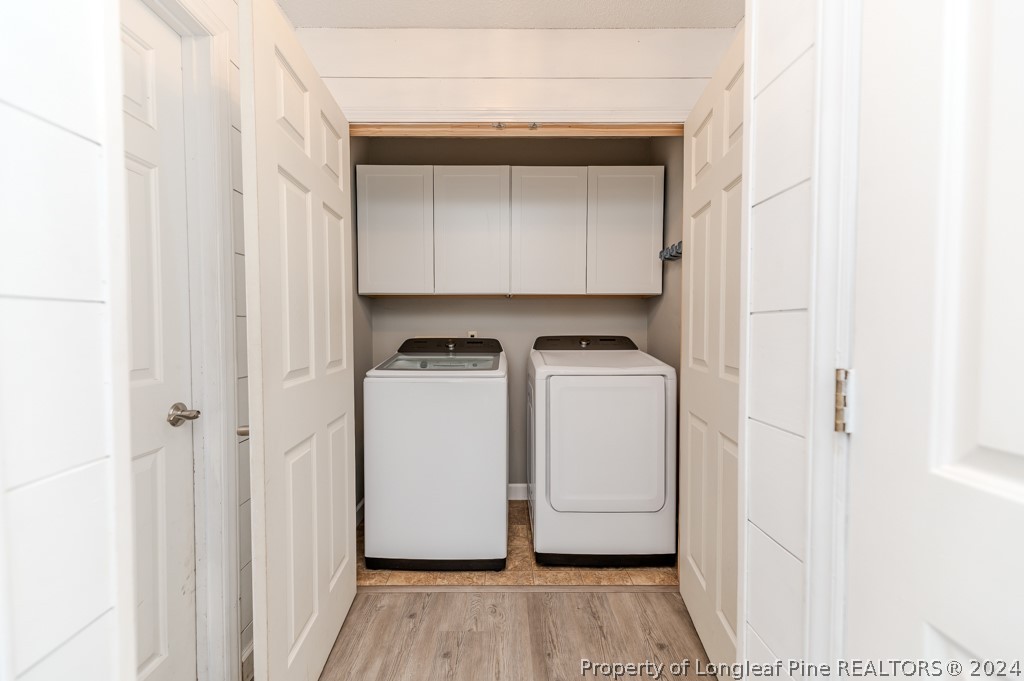 925 Line Road Cameron, NC 28326 - Photo 19 of 42 a utility room with wooden floor washer and dryer
