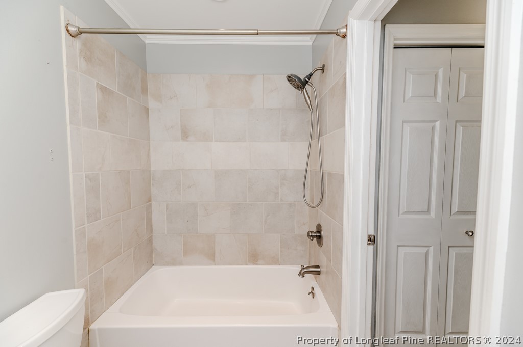 925 Line Road Cameron, NC 28326 - Photo 23 of 42 a bathroom with a shower and a bath tub