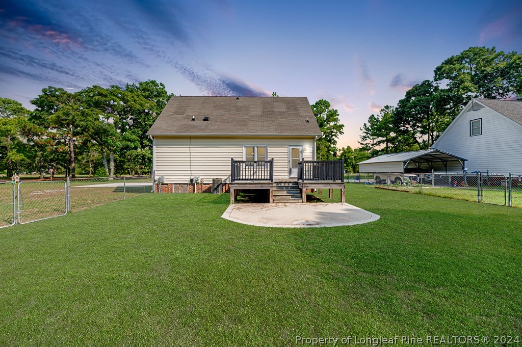 925 Line Road Cameron, NC 28326 - Photo 31 of 42 a view of a house with a backyard and a patio